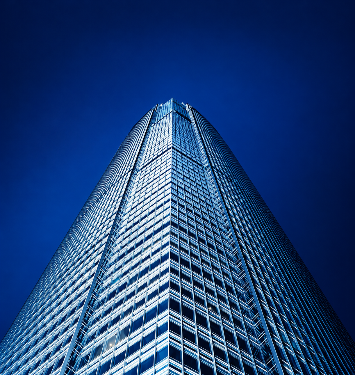 Industry Insight AI Impact - Symmetrical Blue Glass Skyscraper